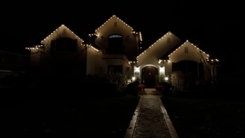 House decorated with Christmas lights at night